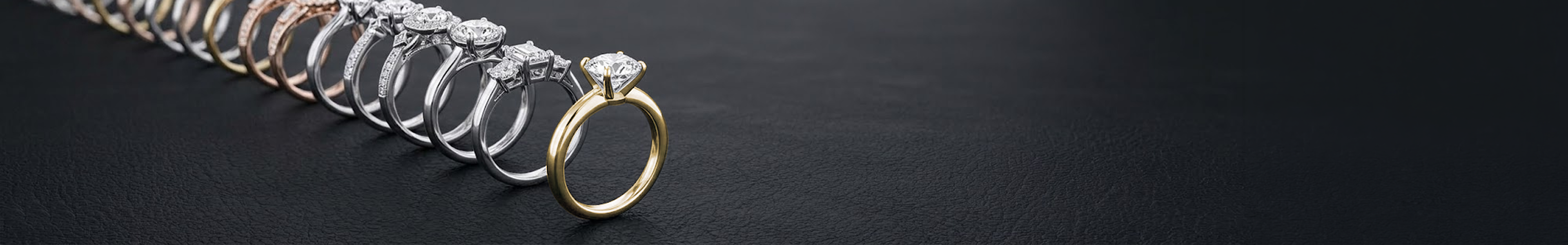 Engagement rings arranged in a line receding into depth — demonstrating cadence and repeat purchase